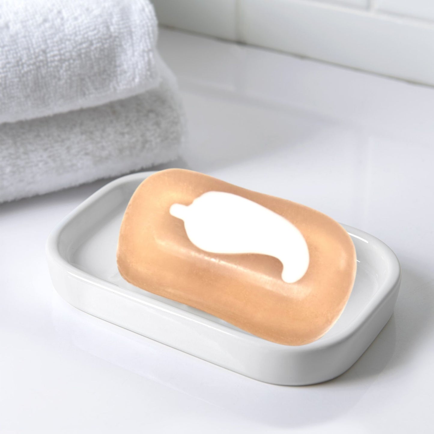 White ceramic soap dish with Spicy Coco Body Bar