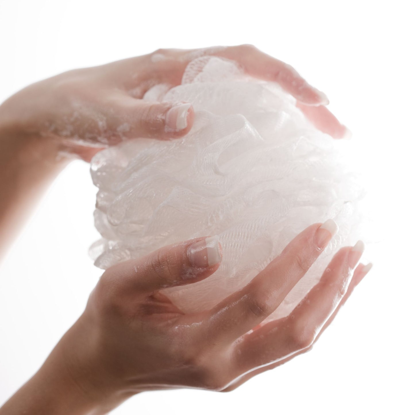 White Loofah in Hands